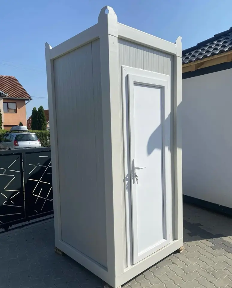 Side view of a white VIP restroom cabin